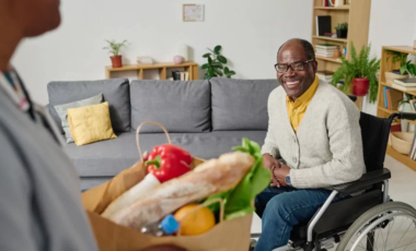 man-with-disability-getting-groceries-from-caregiv-2022-07-28-23-55-46-utc-1024×683